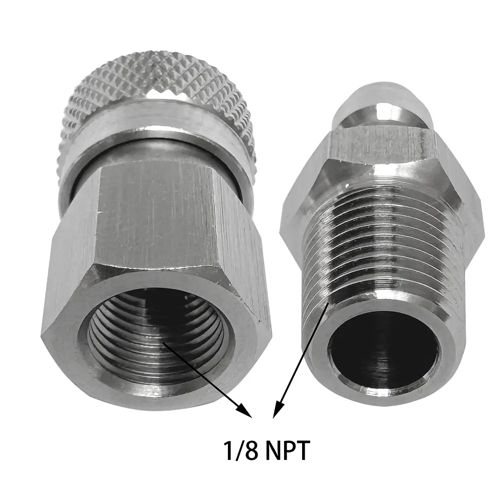 A close up shot of a male and female NPT quick coupling, showcasing the distinct tapered threads used for sealing
